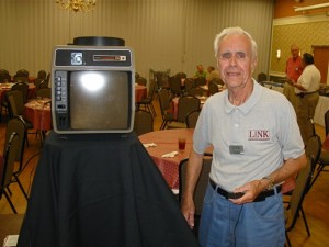 Mr. Arnold used a vintage slide projector to display Link’s photographs.